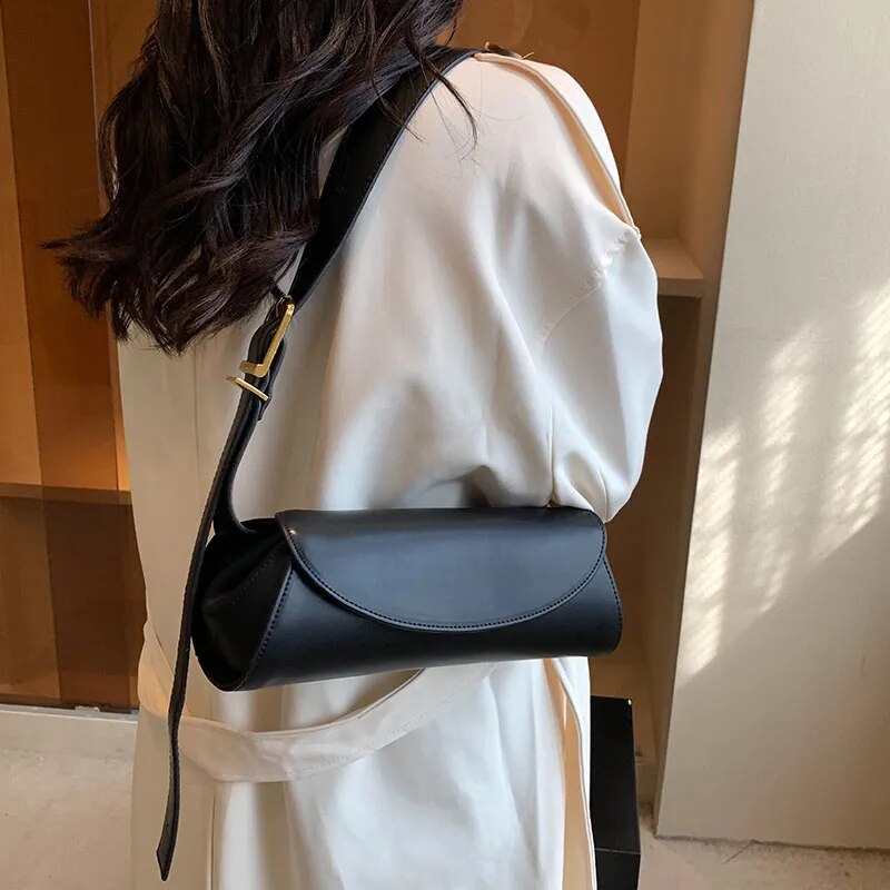 Whether you prefer to wear it over your shoulder or across your body, this bag offers flexibility to complement your unique style.