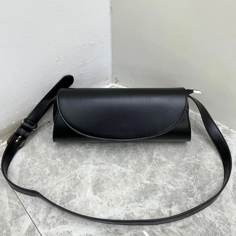 Immerse yourself in the epitome of elegance with the sleek and contemporary design of this shoulder bag