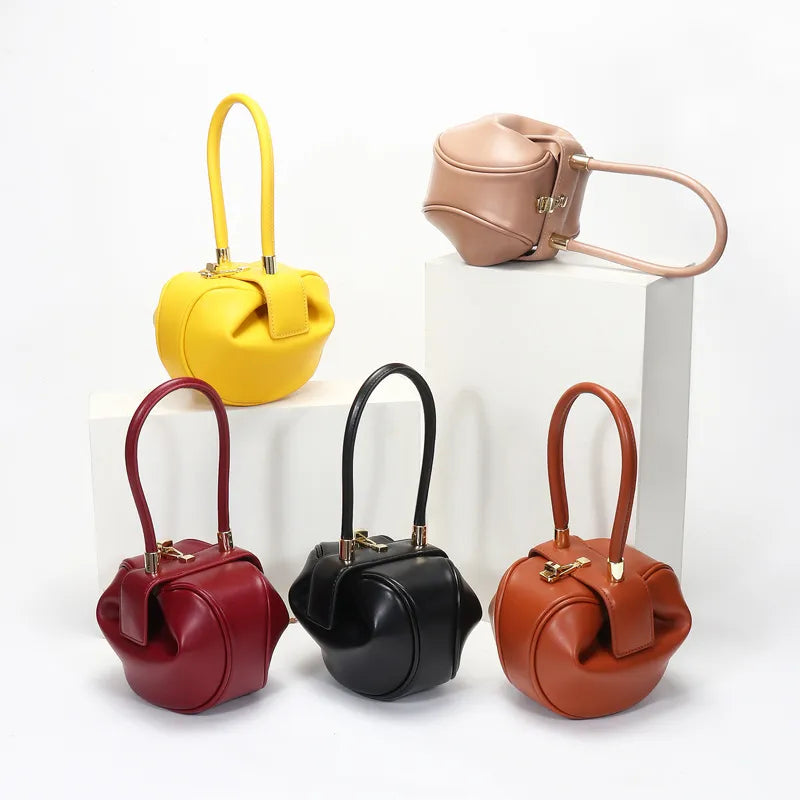 The round ball shape of this handbag is a delightful departure from traditional handbag designs. It's perfect for those looking to express their individuality and creativity.